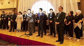 Takahashi Tokuji Shoten employees on the stage at the end of the ceremony